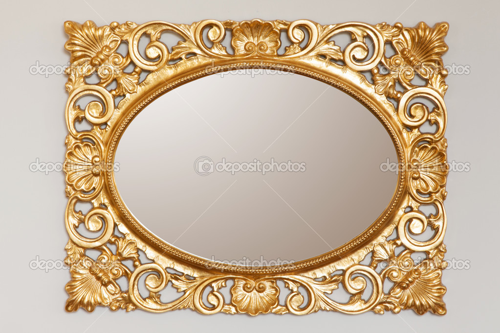 Golden mirror frame on the wall
